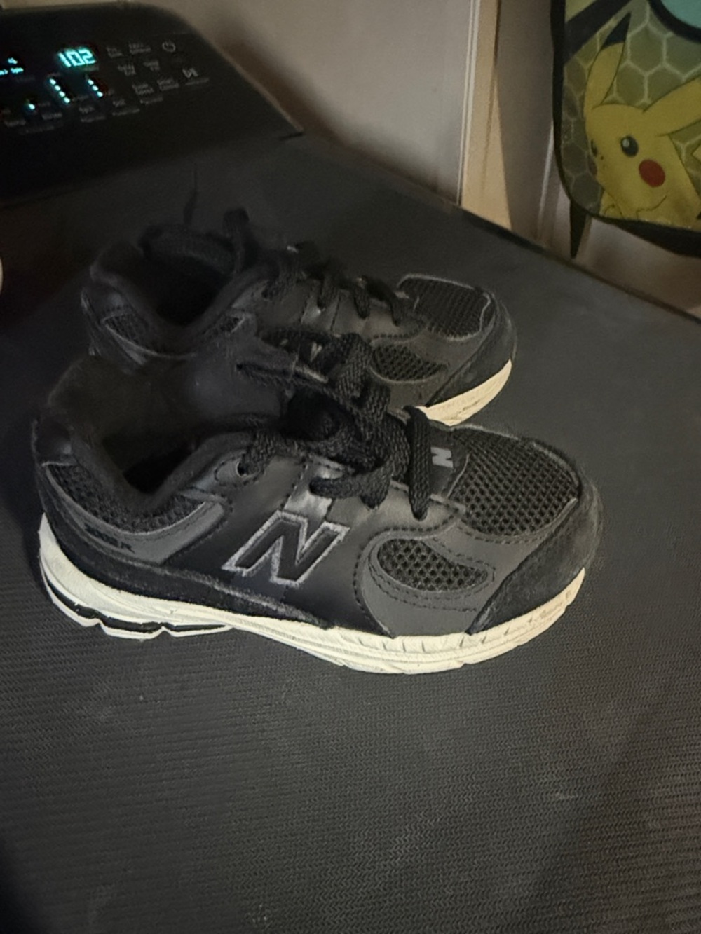 New Balance Kids Black and Cream Athletic Sneakers